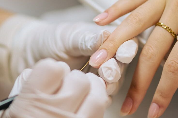 Polished manicure, part of nails, brows and waxing at Gifted MO